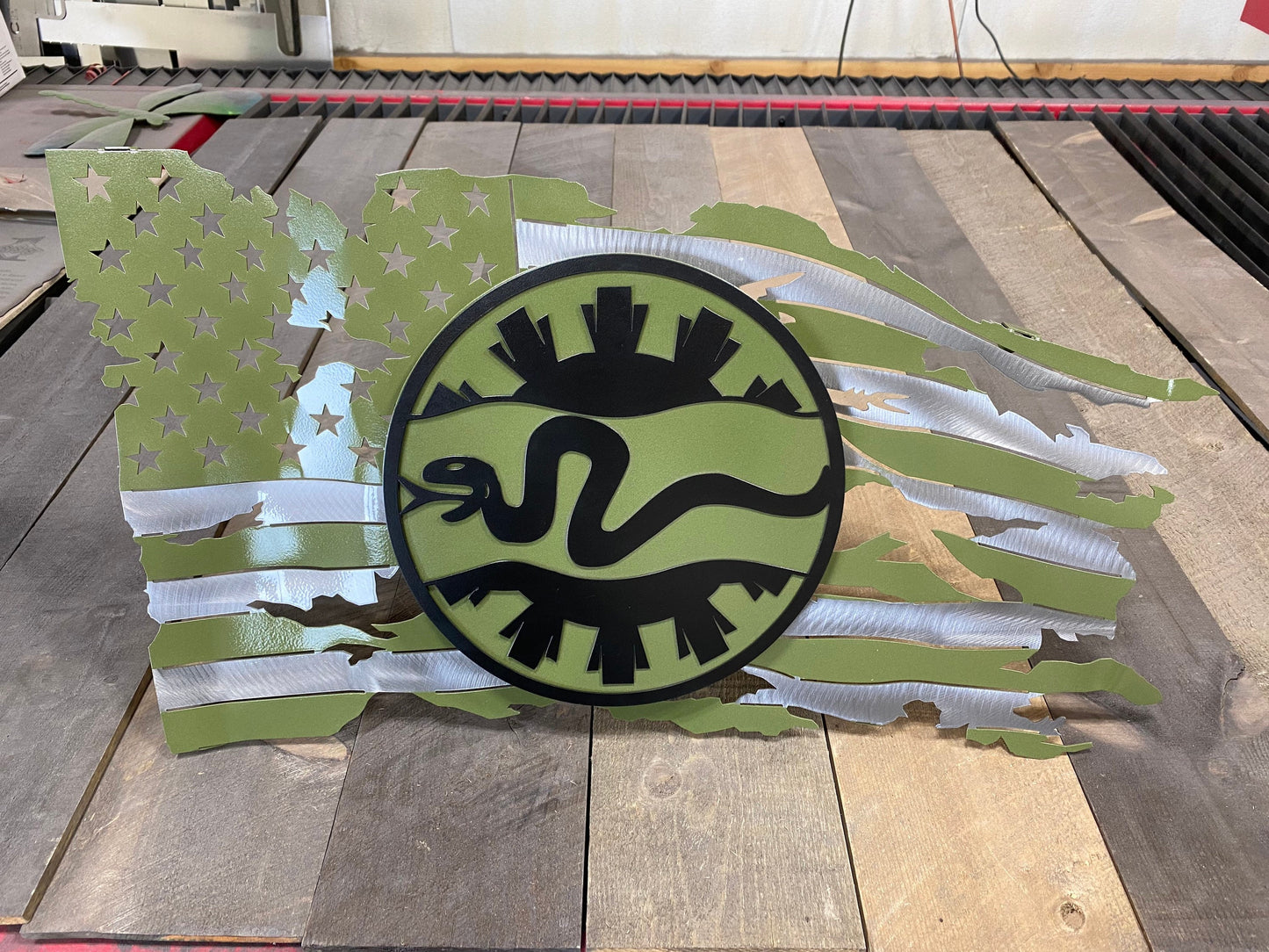Metal American flag wall art with 116th Cavalry Brigade emblem raised on steel studs.