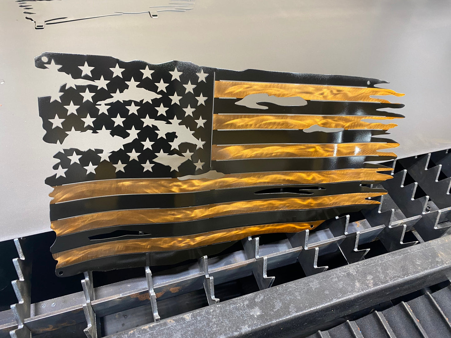 Black and copper metal American flag with hand-formed waves