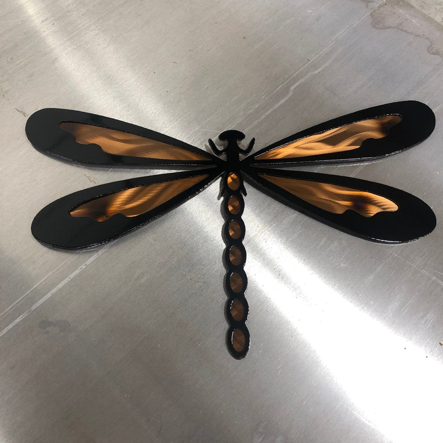 Colorful metal dragonfly wall art made from handcrafted American steel