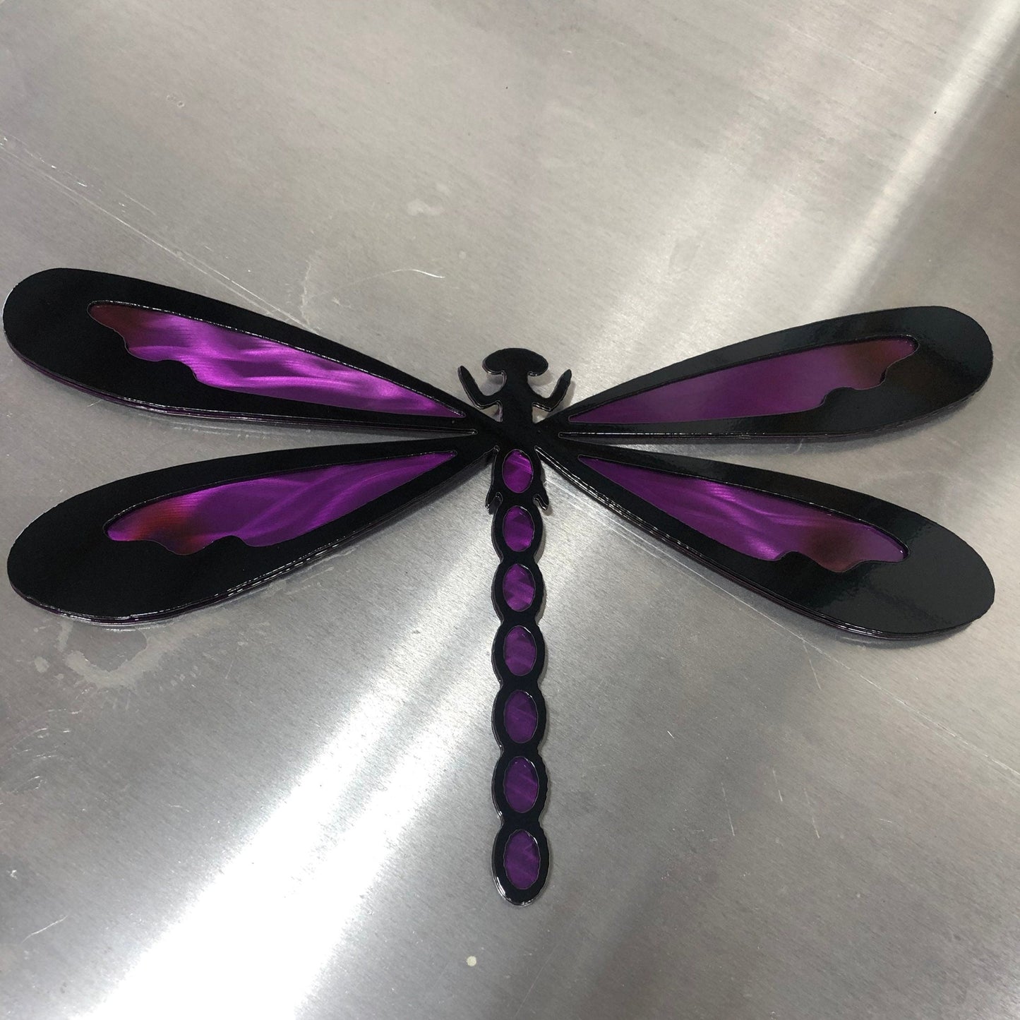 Colorful metal dragonfly wall art made from handcrafted American steel
