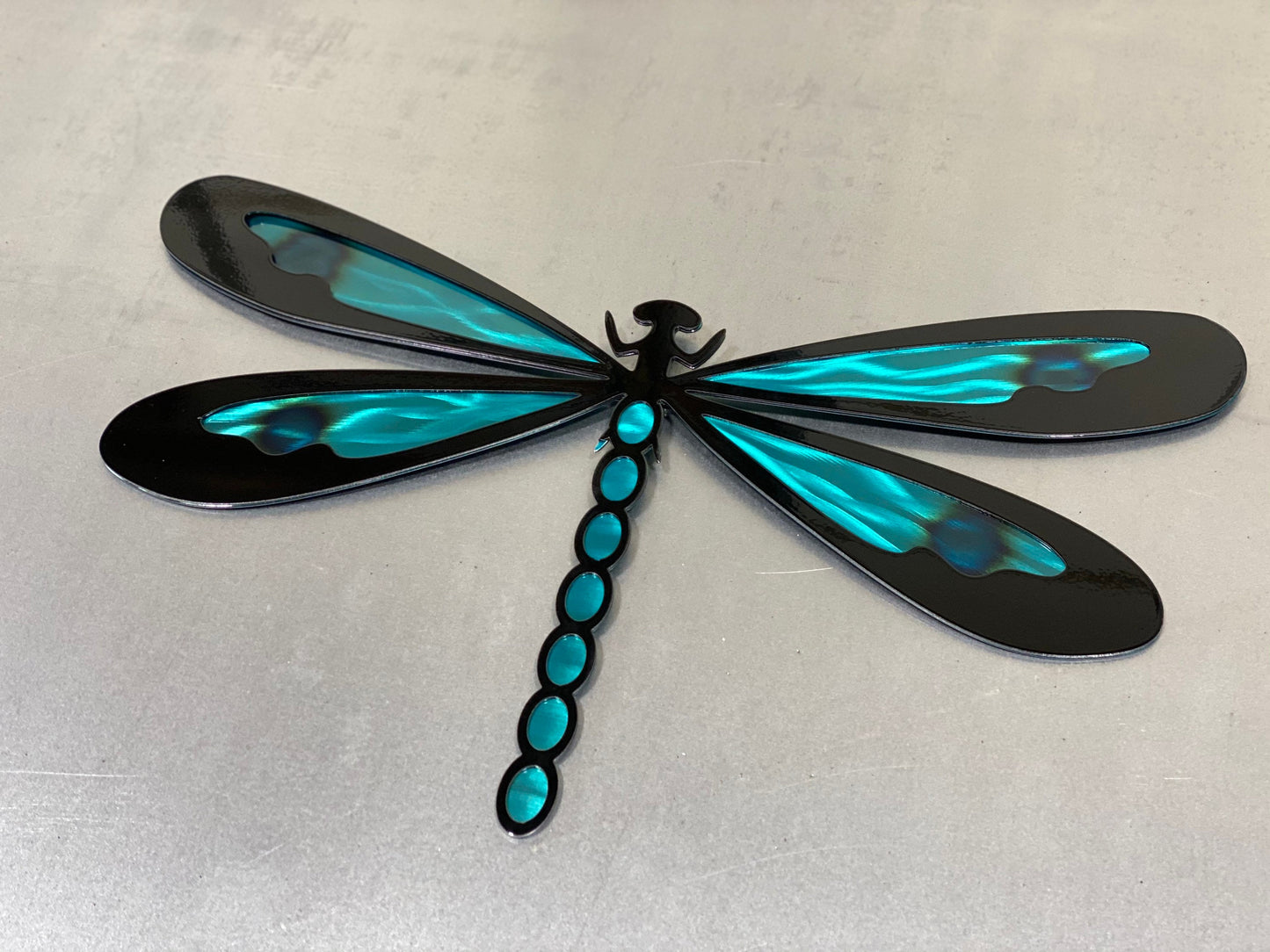 Colorful metal dragonfly wall art made from handcrafted American steel