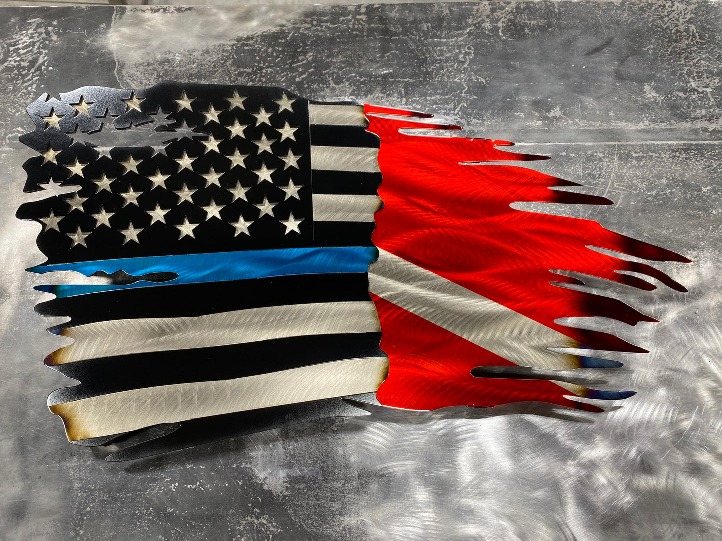 CNC-cut metal flag combining Thin Blue Line and Diver Down symbols with a distressed finish