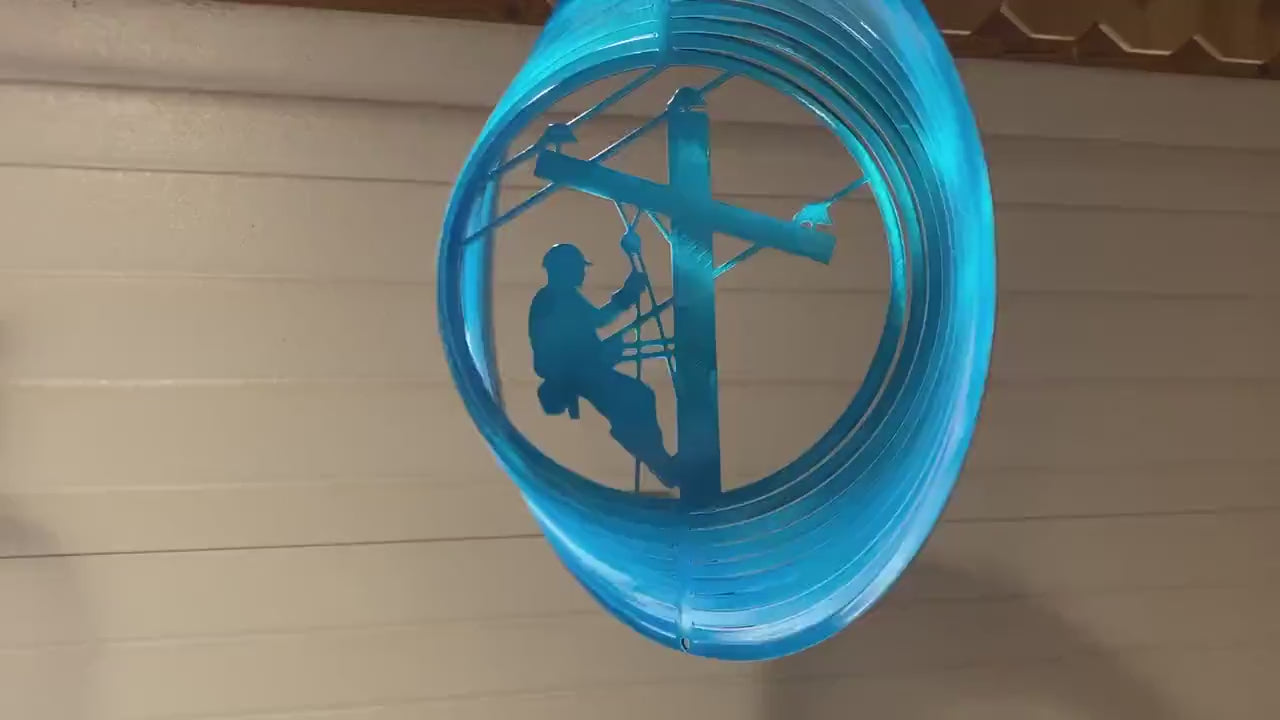 Lineman wind spinner made from powder coated metal for patriotic garden decor