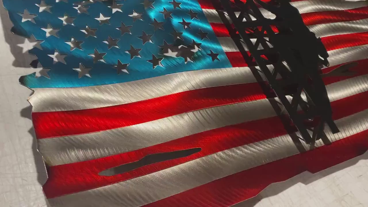 Metal American flag with lineman climbing cell tower silhouette