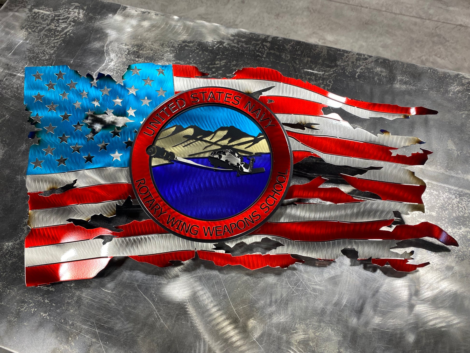 Rotary Wing Weapons School metal art with full-color insignia and American flag