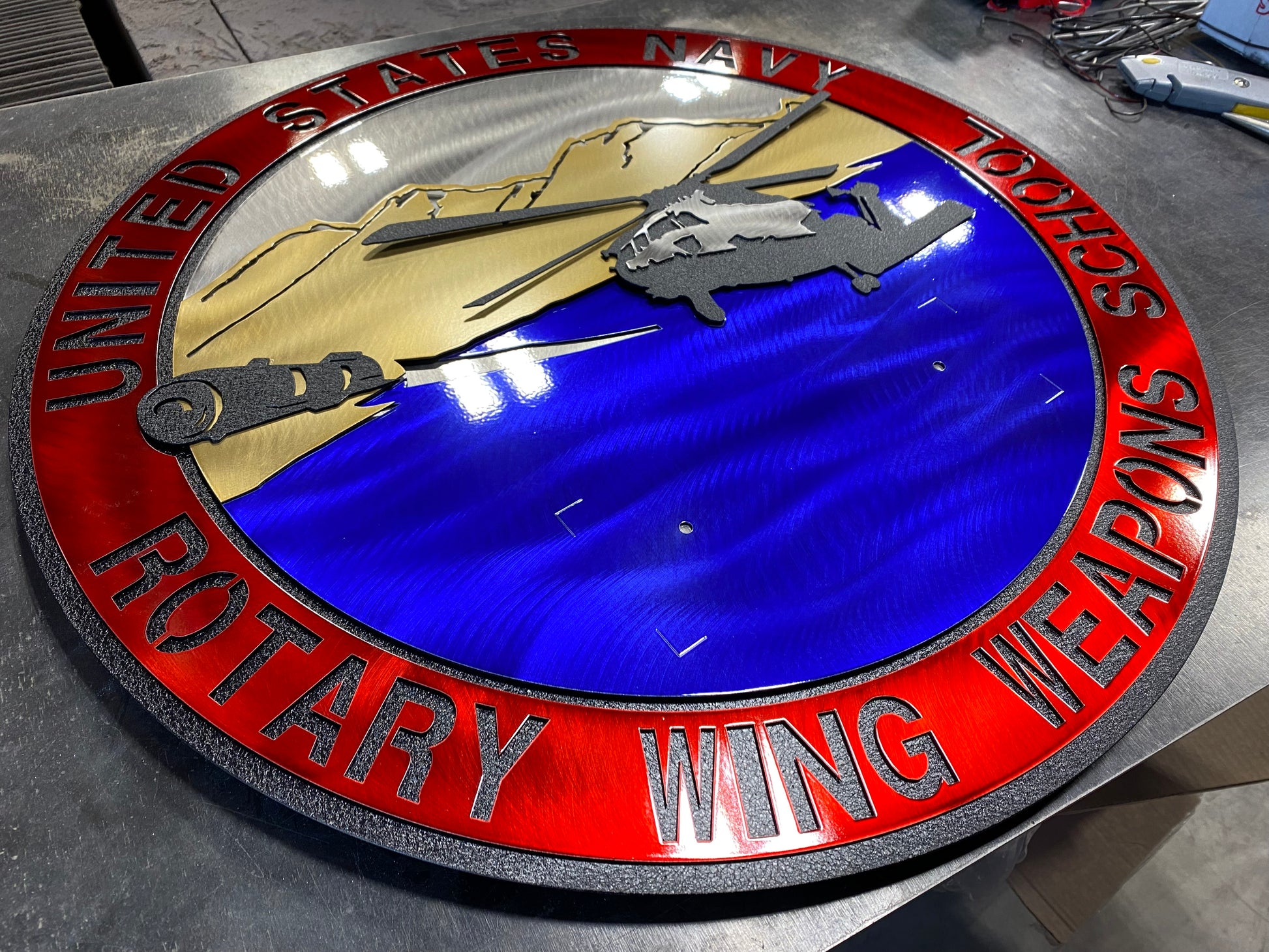 Rotary Wing Weapons School metal art with full-color insignia and American flag