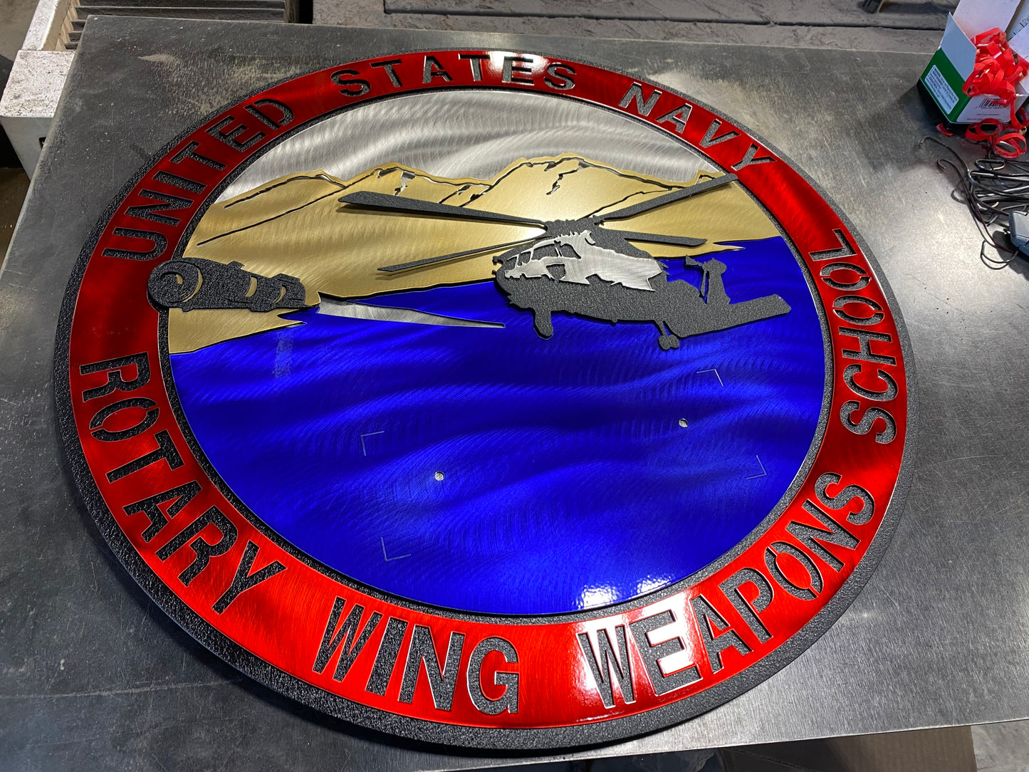 Rotary Wing Weapons School metal art with full-color insignia and American flag