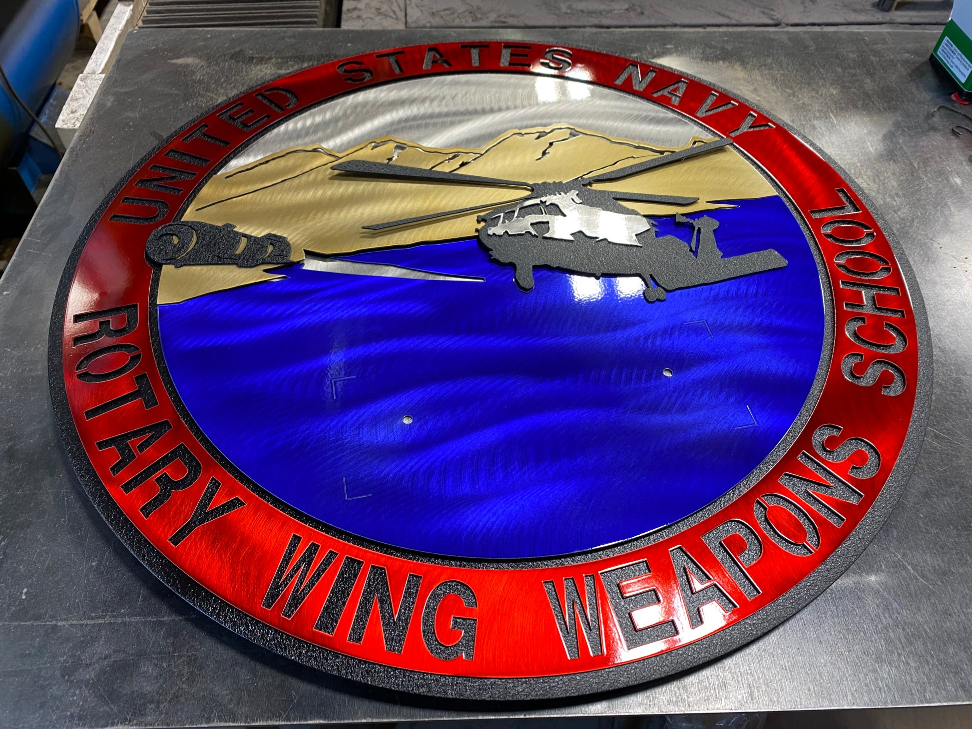 Rotary Wing Weapons School metal art with full-color insignia and American flag
