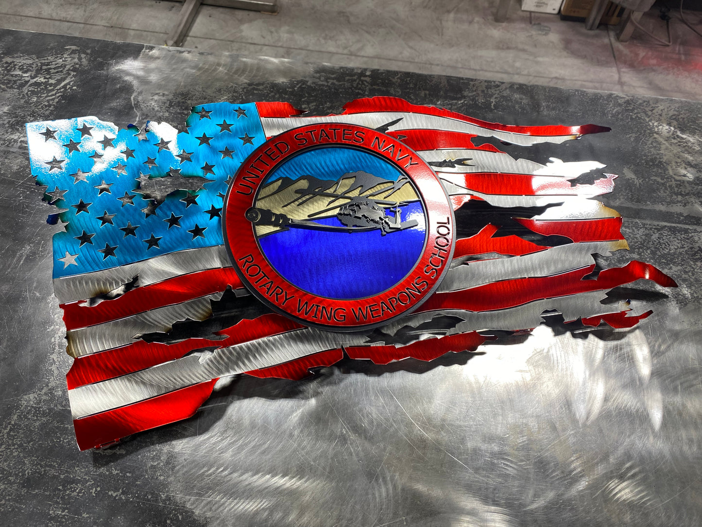 Rotary Wing Weapons School metal art with full-color insignia and American flag