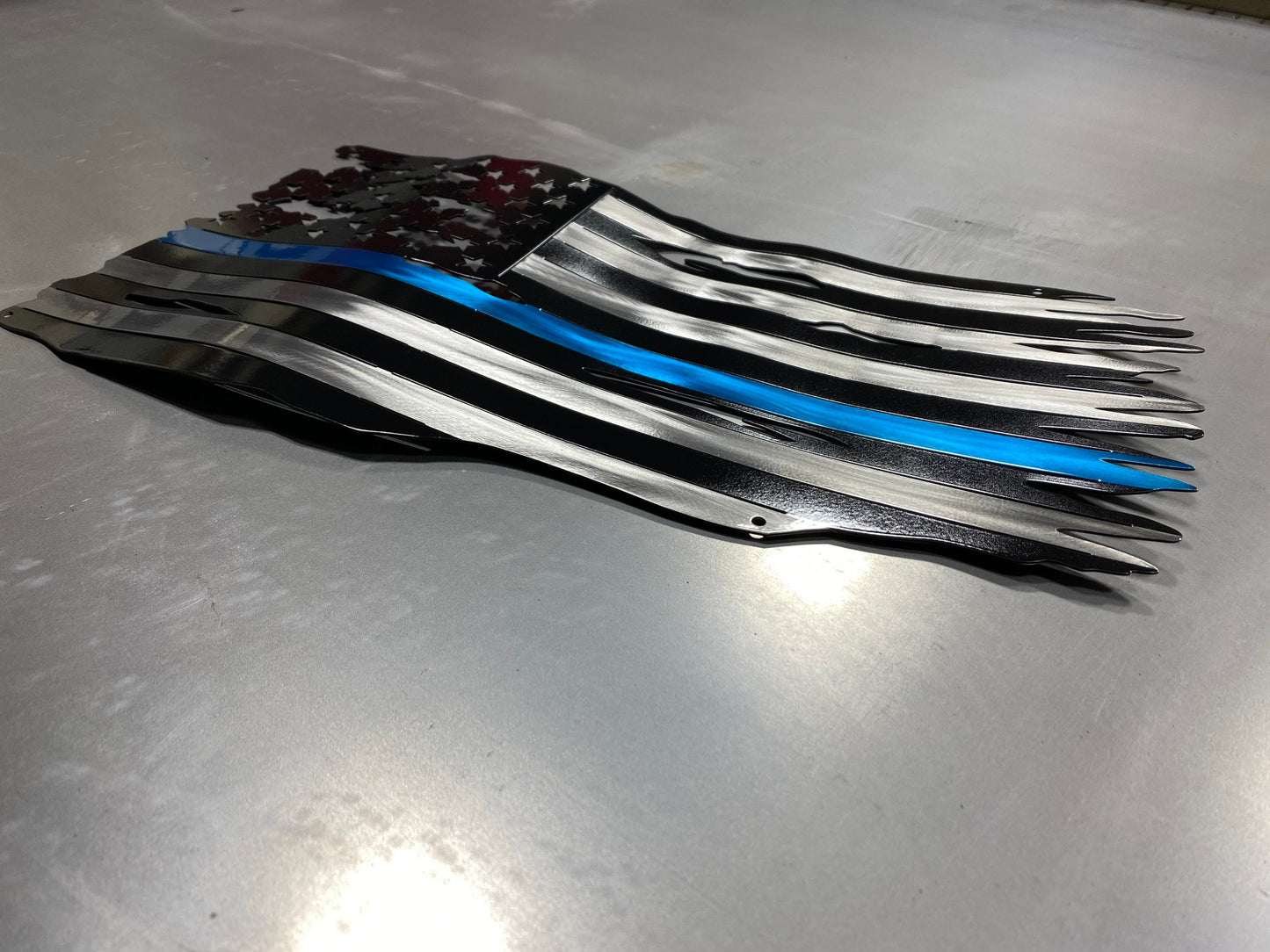 Thin Blue Line metal American flag made from powder coated steel, honoring law enforcement service, handcrafted by CnS CnC in the USA