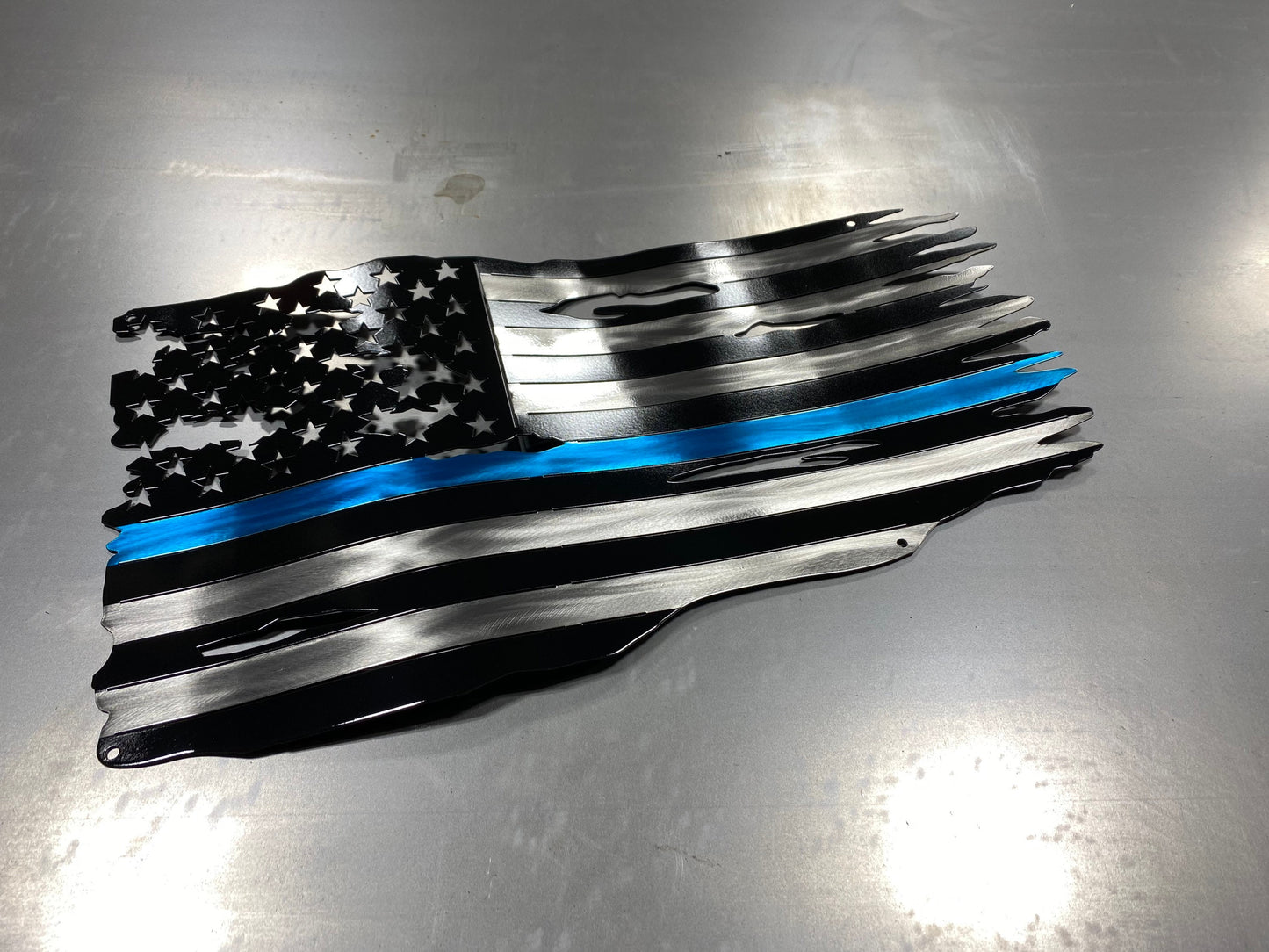 Thin Blue Line metal American flag made from powder coated steel, honoring law enforcement service, handcrafted by CnS CnC in the USA