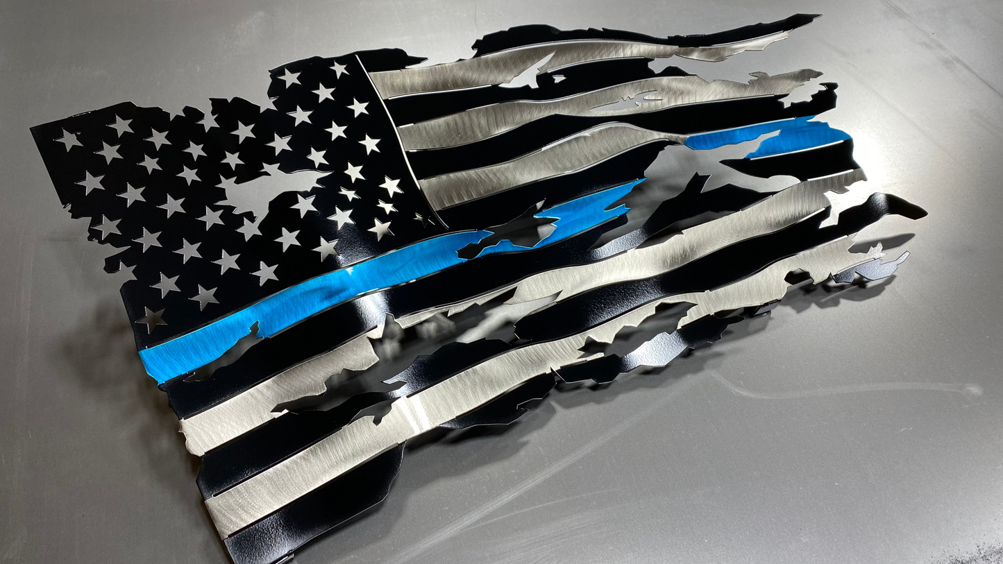 Thin Blue Line wavy metal flag, hand-formed with a three-stage powder-coated finish, measuring 24 inches wide.