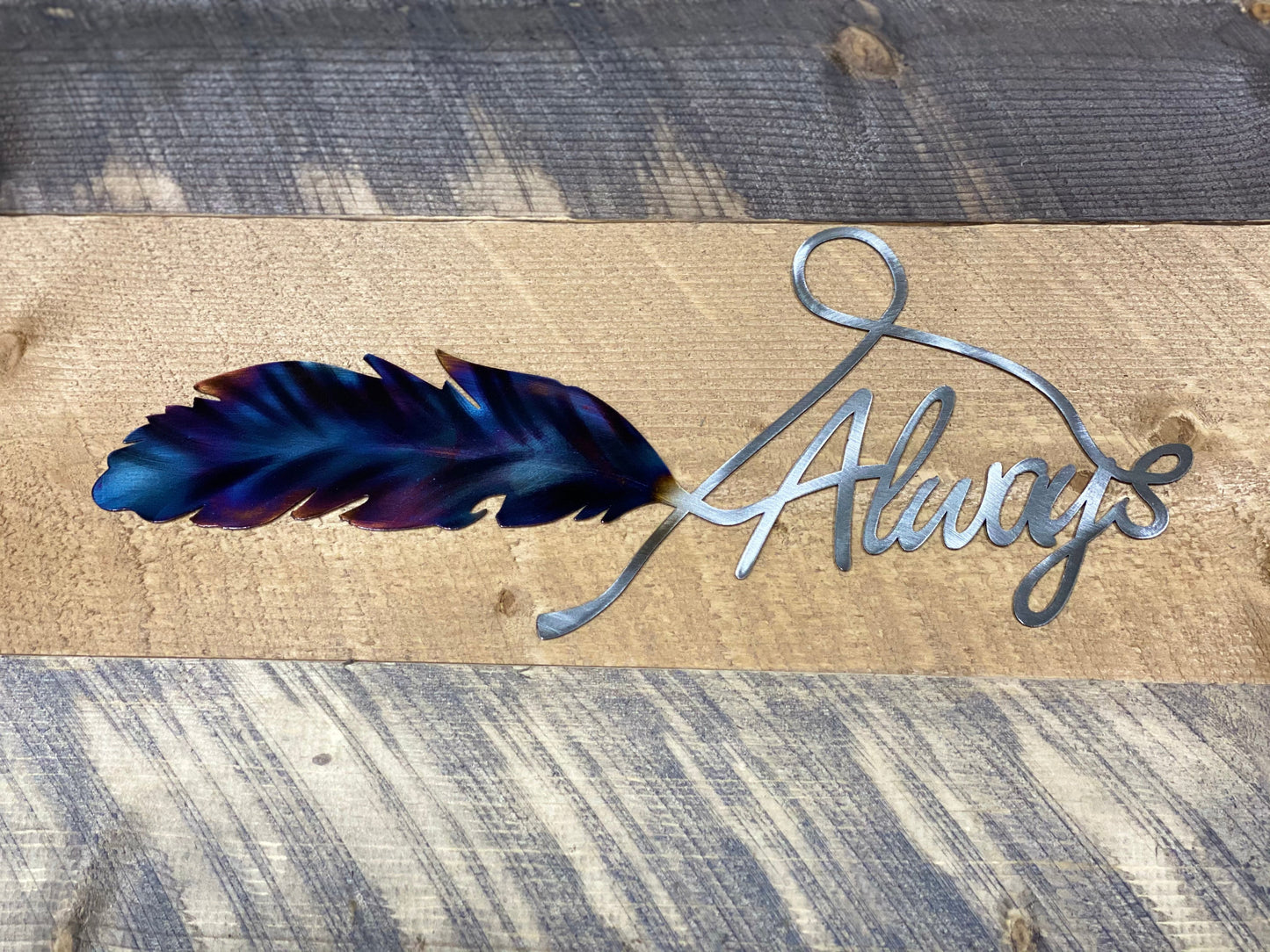 Always Feather metal wall art, handcrafted from American steel, heat-treated for blue and purple hues, and finished with a clear powder coat