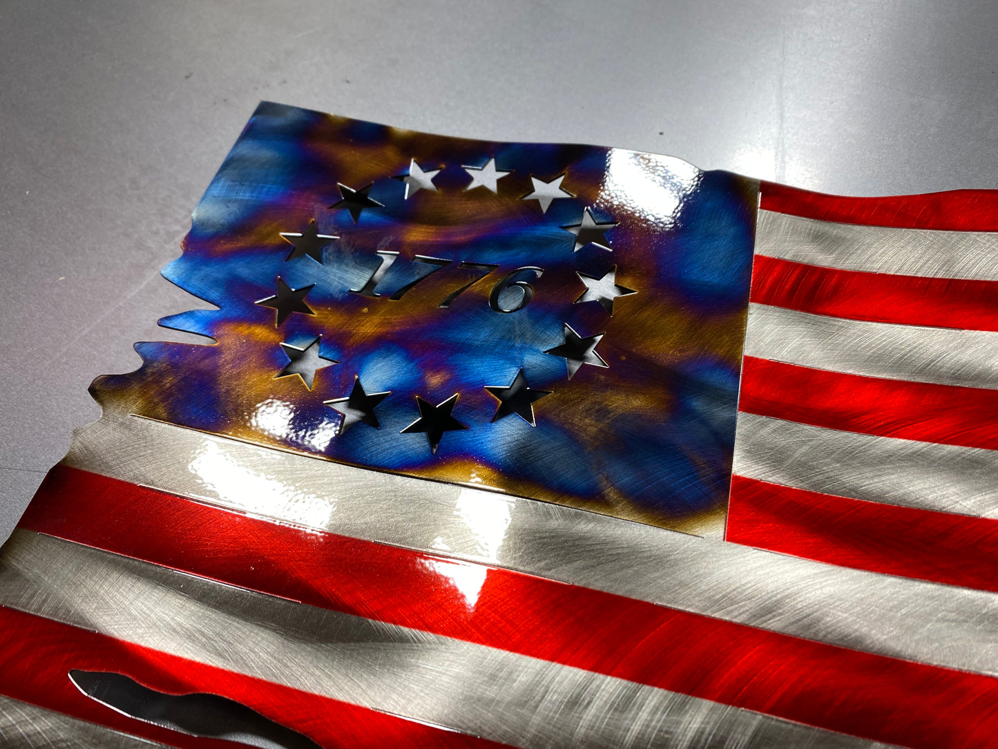 Betsy Ross American Flag metal wall art with heat patina star field, handcrafted from steel, with Candy Blue and Red powder coat