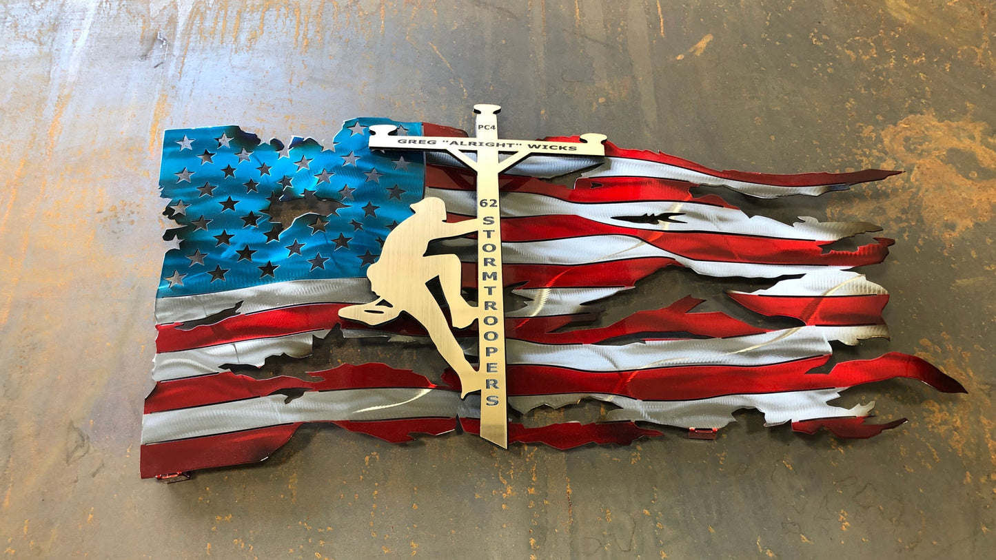 Lineman American Flag featuring a wavy battle-worn metal design with a customizable floating gold lineman. Engraved details available.