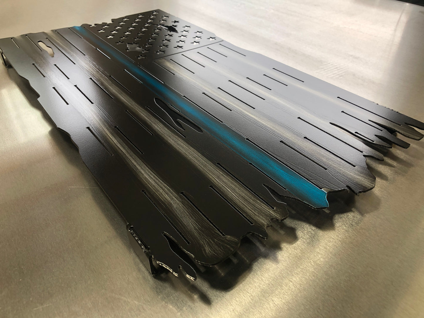 Thin Blue Line Distressed American Flag made from marine-grade aluminum with a weather-resistant finish, designed for police officers and law enforcement.