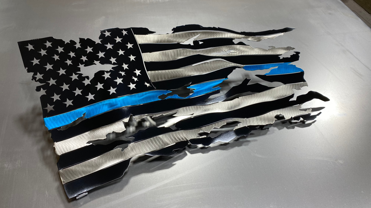 Thin Blue Line wavy metal flag, hand-formed with a three-stage powder-coated finish, measuring 24 inches wide.
