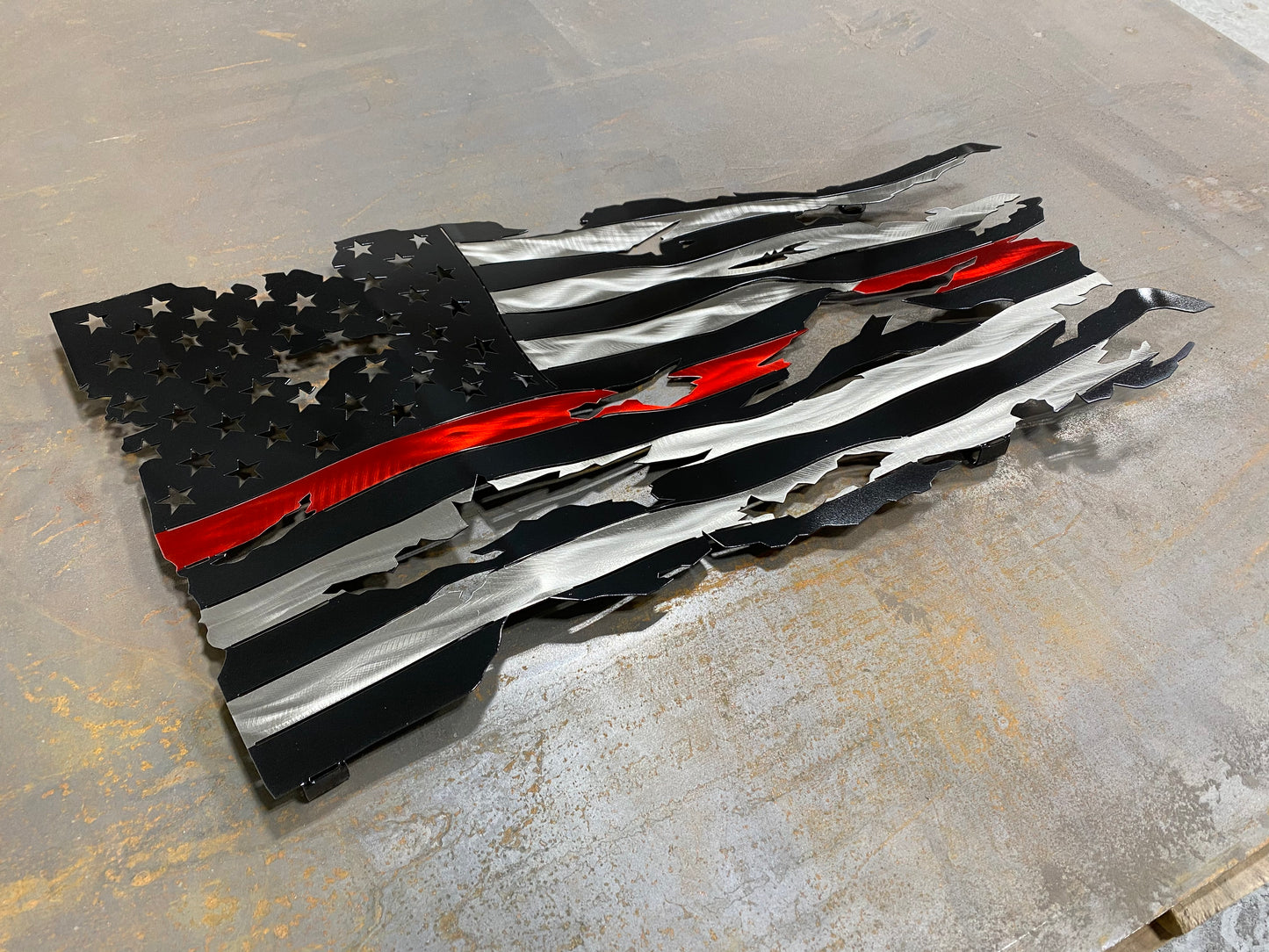 Thin Red Line Battle Worn Flag, handcrafted metal American flag with a rugged design, hand-formed waves, and powder-coated finish by CnS CnC.