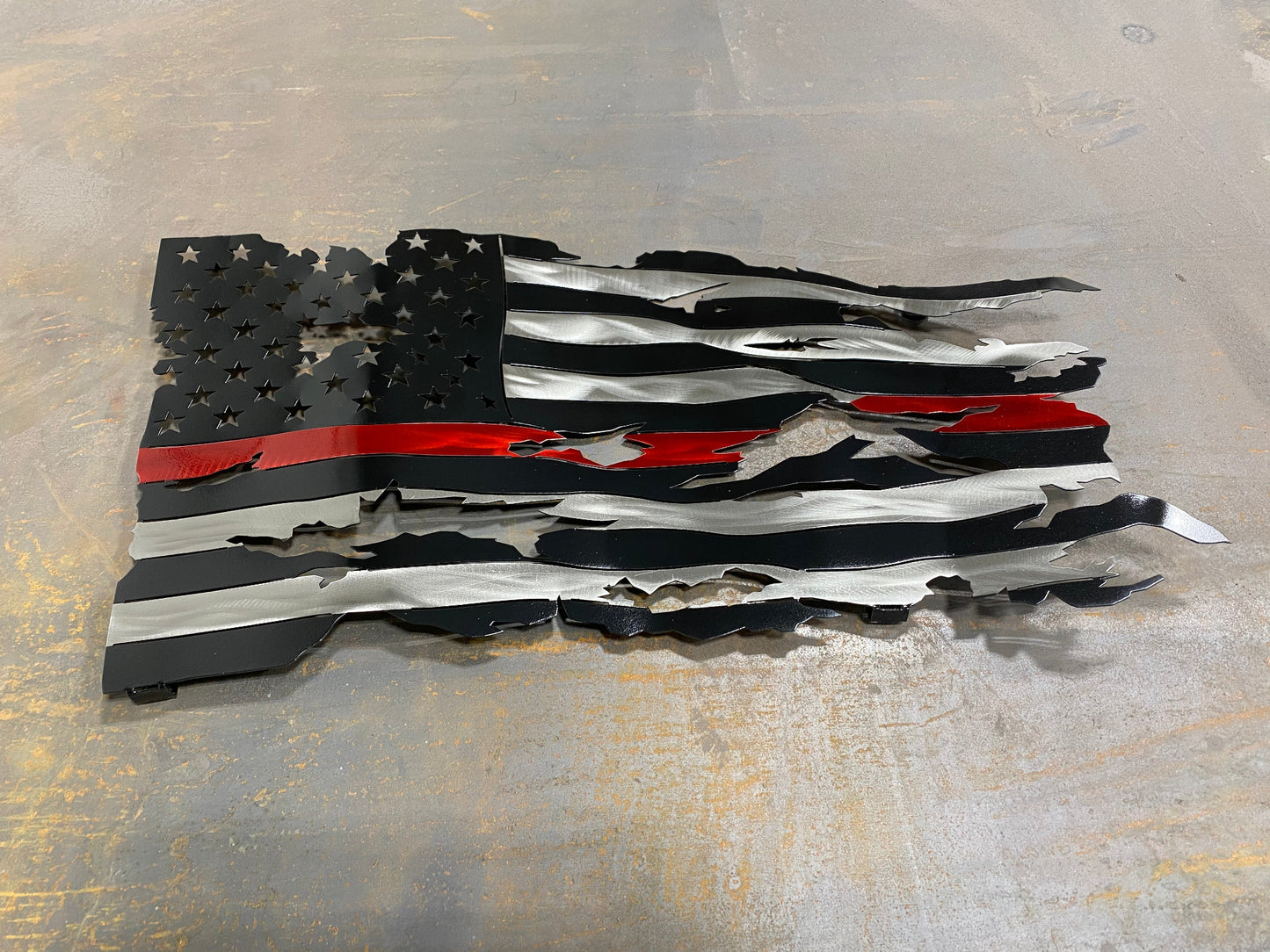 Thin Red Line Battle Worn Flag, handcrafted metal American flag with a rugged design, hand-formed waves, and powder-coated finish by CnS CnC.