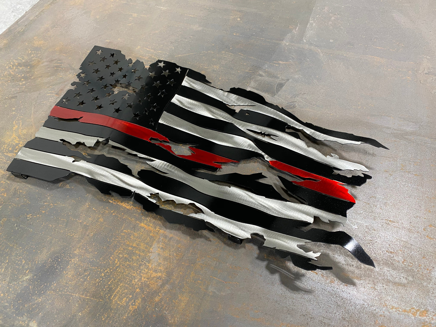 Thin Red Line Battle Worn Flag, handcrafted metal American flag with a rugged design, hand-formed waves, and powder-coated finish by CnS CnC.