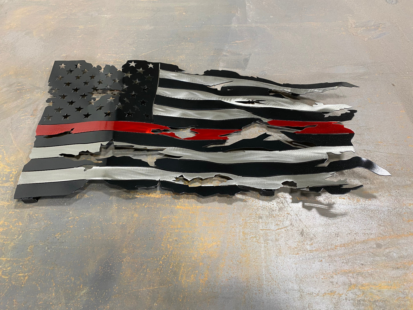 Thin Red Line Battle Worn Flag, handcrafted metal American flag with a rugged design, hand-formed waves, and powder-coated finish by CnS CnC.