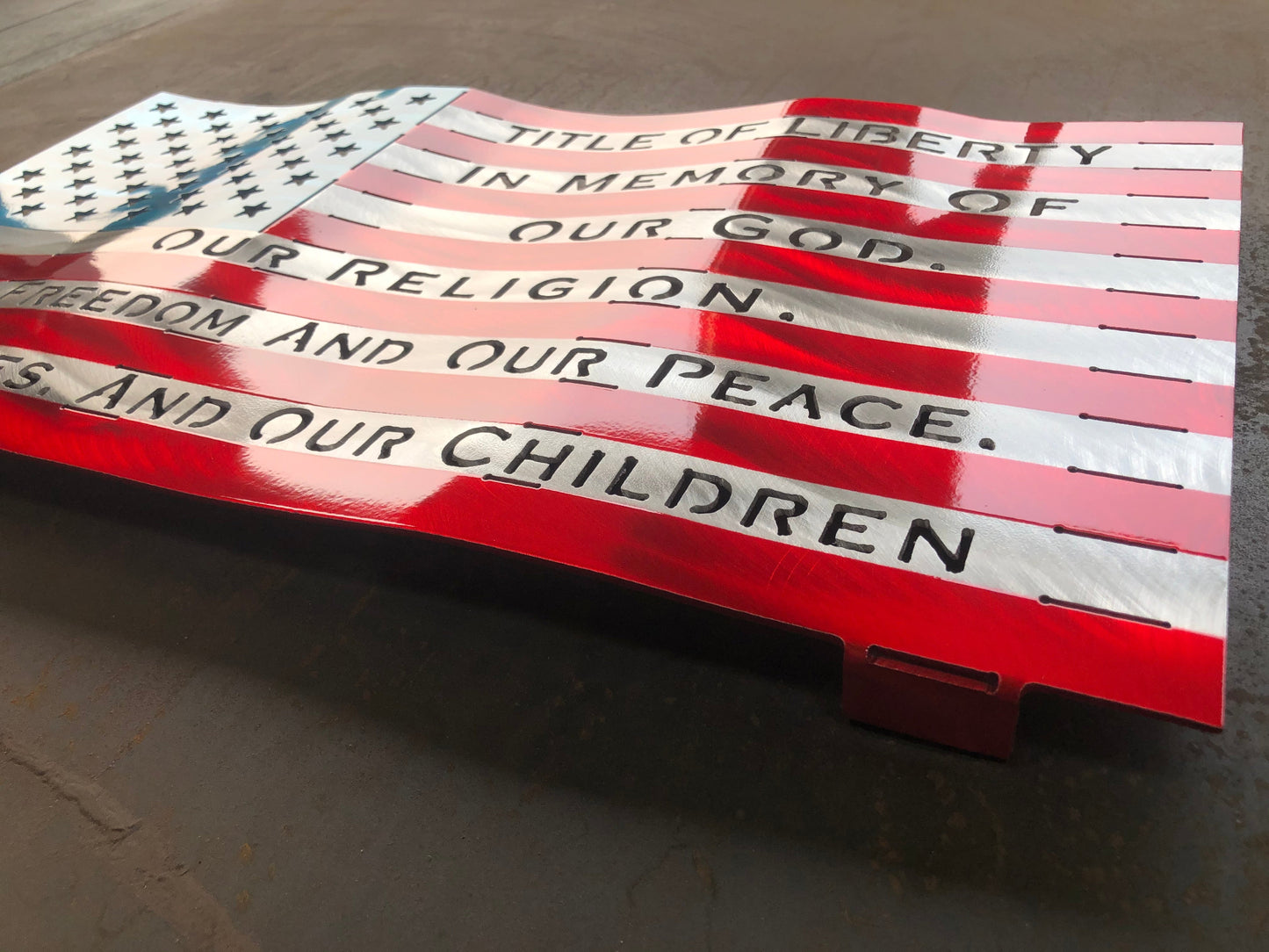 Title of Liberty American Flag, handcrafted from marine-grade aluminum with hand-formed waves and a three-stage powder-coated finish by CnS CnC.