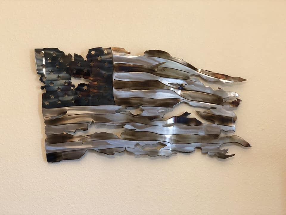 Wavy battle worn American flag with heat patina finish, handcrafted metal art by CnS CnC