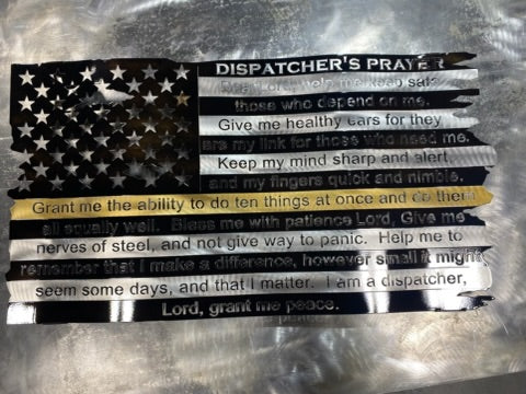 Battle-worn American flag metal wall art with precision-cut wave patterns in matte black powder-coated steel, featuring dimensional stars and stripes design.