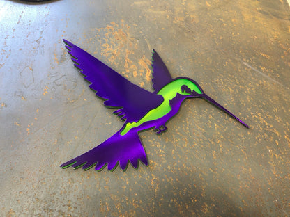 Colorful metal hummingbird wall art in candy grape and lime finish, 9.75x8 inches, with layered steel design and integrated hanger