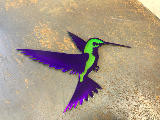 Colorful metal hummingbird wall art in candy grape and lime finish, 9.75x8 inches, with layered steel design and integrated hanger
