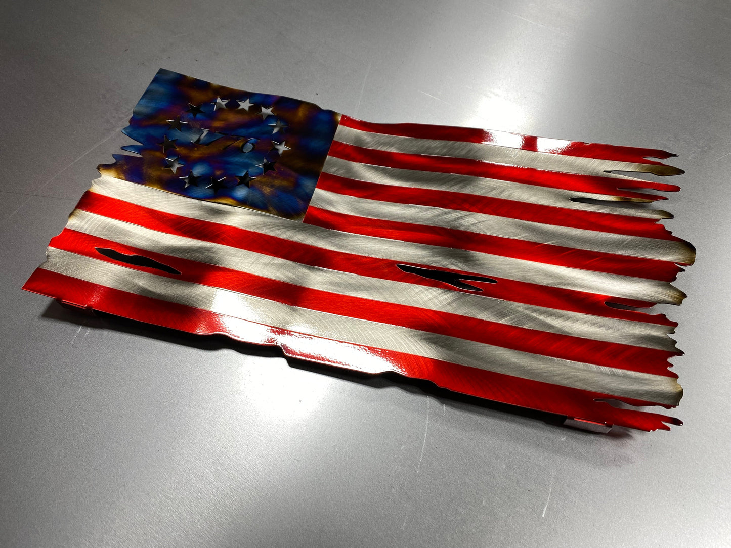 Betsy Ross American Flag metal wall art with heat patina star field, handcrafted from steel, with Candy Blue and Red powder coat by CnS CnC.