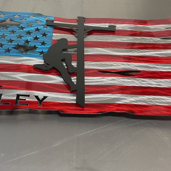 Tattered Lineman Flag with Personalization, handcrafted metal wall art featuring a floating lineman silhouette and custom details, made by CnS CnC.
