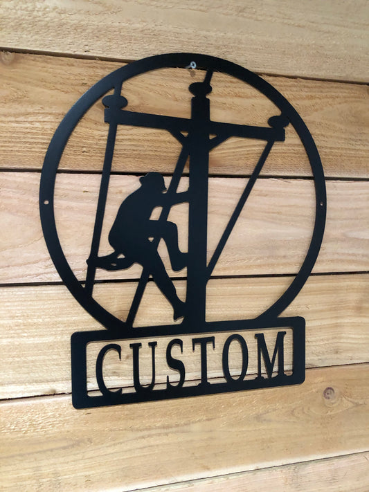 Custom Large Lineman Monogram featuring a personalized last name, crafted from powder-coated aluminum for electricians and powerline workers.