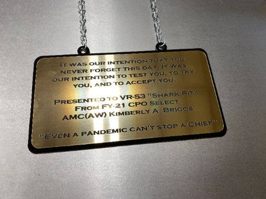 Custom add-on plaque for USN metal flags – engraved gold Rowmark dedication plaque, suspended with chain, available only with a USN flag purchase from CnS CnC.